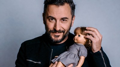Man holding doll