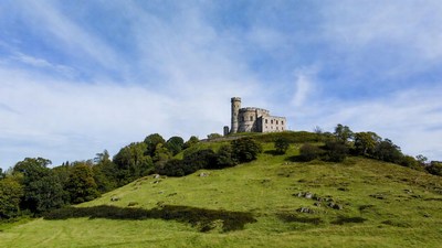 Castle atop green hill