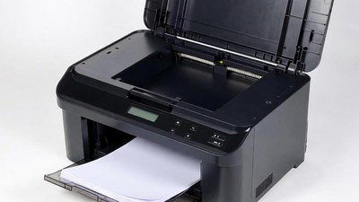Open black laser printer with paper tray