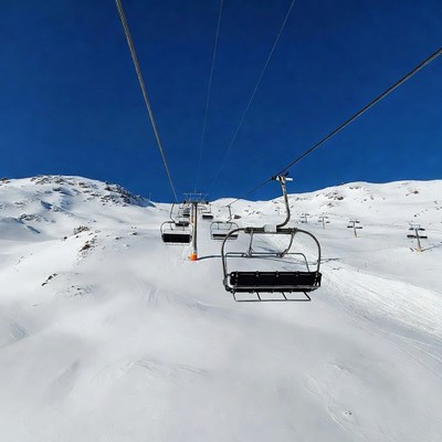 Ski Lift Chairs Over Snowy Mountain Slope