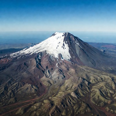 Snow-capped volcano aerial view
