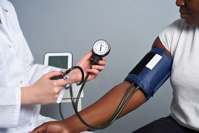 Nurse measuring blood pressure on patient
