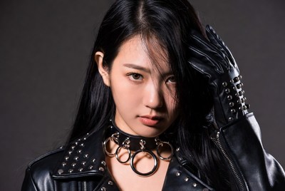Asian woman in leather choker and gloves