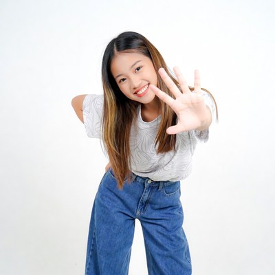 Asian girl making stop hand gesture