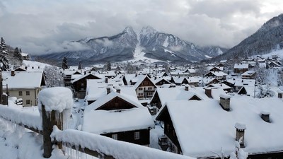 Snowy Alpine Village with Mountains