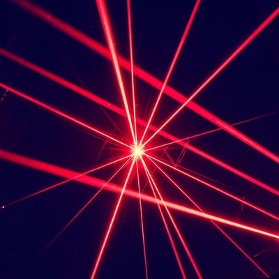 Red laser beams on black background