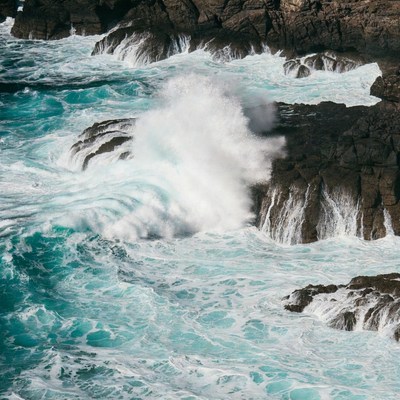 Ocean Waves Crashing on Rocky Cliffs