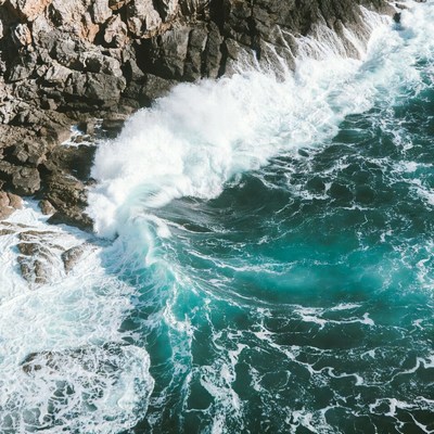 Ocean Waves Crashing on Rocky Cliffs
