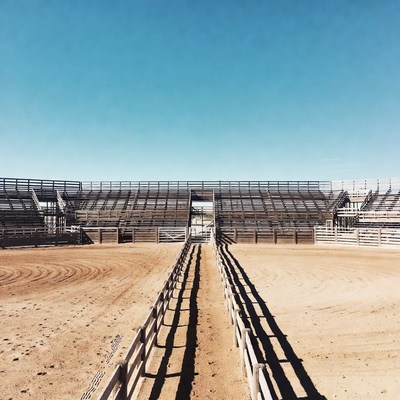 Empty Rodeo Arena with Dirt Path