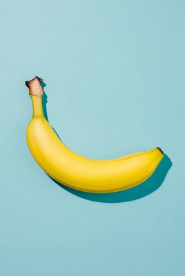 Yellow banana on blue background