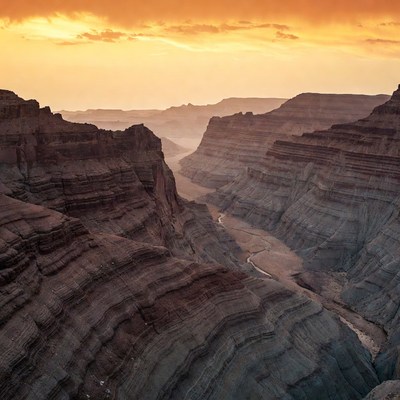 Sunset over layered canyon landscape