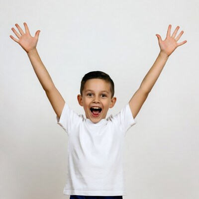 Boy raising arms excitedly