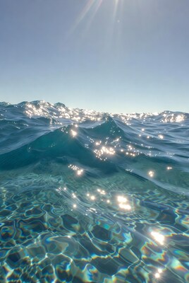 Sparkling turquoise ocean waves sunlight