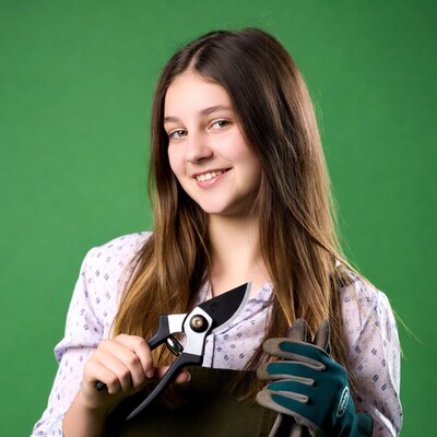Girl holding pruners with gloves
