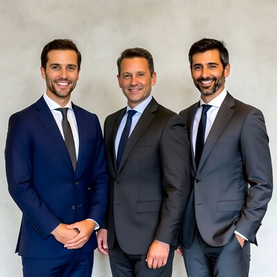 Three smiling men in suits