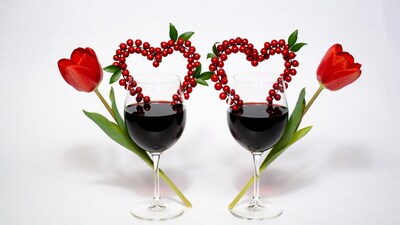 Wine glasses with heart berries and tulips