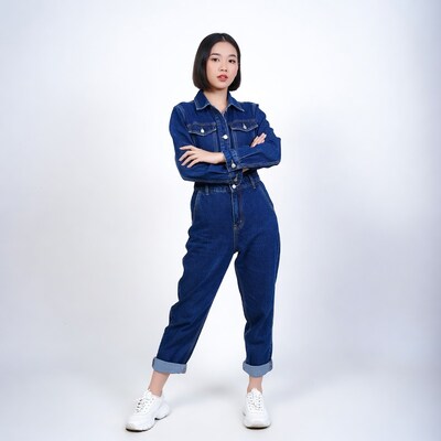 Asian woman in blue denim jumpsuit