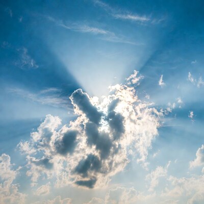 Sun rays beaming through clouds