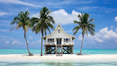 White stilt house on tropical island