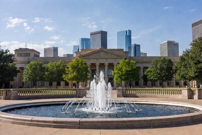 Fountain Before Neoclassical Building and Skyscrapers