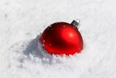 Red Christmas ornament in snow