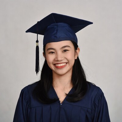 Asian girl in graduation gown and cap