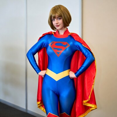 Woman in Supergirl cosplay costume