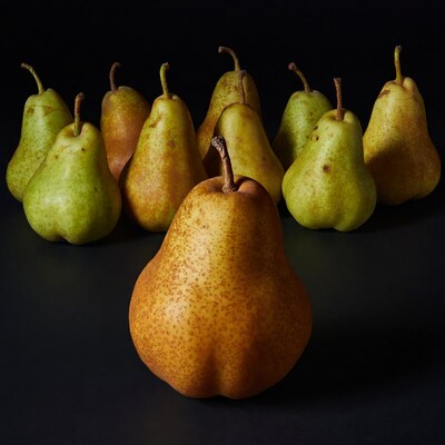 Pears arranged on black background