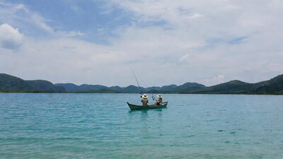 Man and woman fishing from boat
