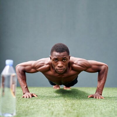 Muscular Black man doing pushups