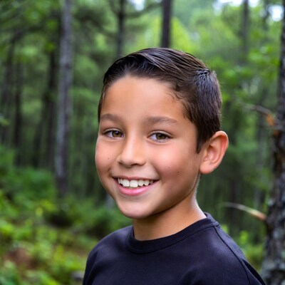 Smiling boy in forest