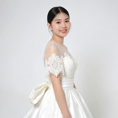 Asian woman in lace wedding dress