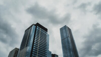 Skyscrapers under cloudy sky