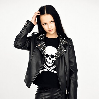 Girl in studded leather jacket with skull