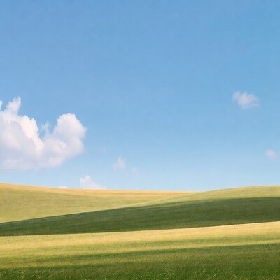 Rolling green hills under blue sky