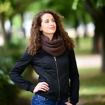 Woman with curly hair in park