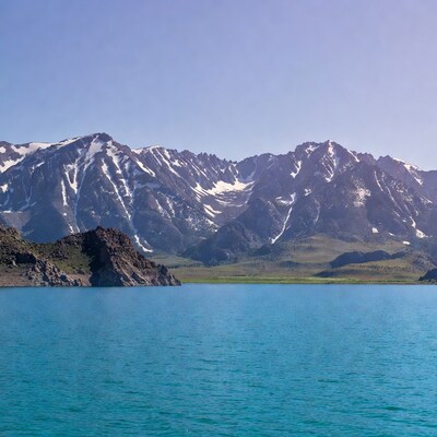 Turquoise lake with snow-capped mountains