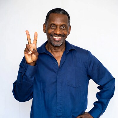 African-American man making peace sign