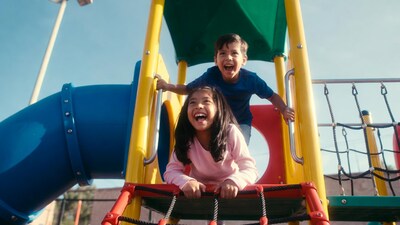 Asian boy and girl playing on playground