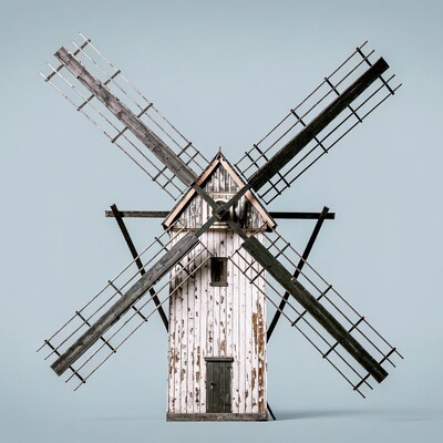 Old wooden windmill isolated background