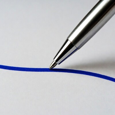 Silver pen drawing blue line