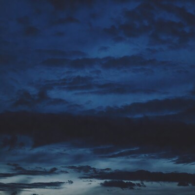 Dark Blue Cloudy Night Sky