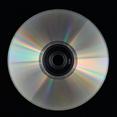 Shiny CD Disc on Black Background