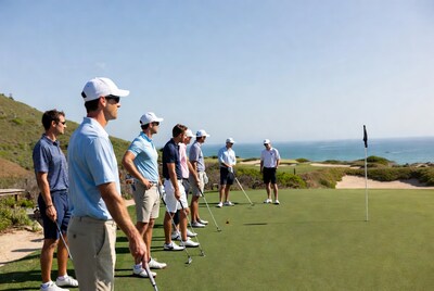 Group of men golfing on coastal green