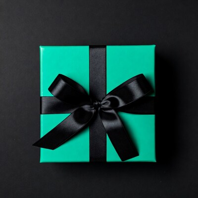 Teal gift box with black bow