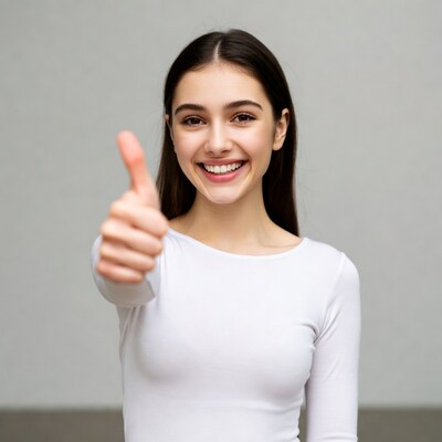 Young woman giving thumbs up