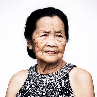 Elderly Asian woman in sequin dress