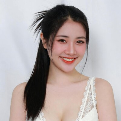 Asian woman in lace lingerie smiling