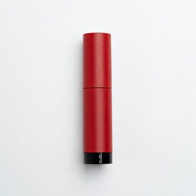 Red lipstick tube on white background