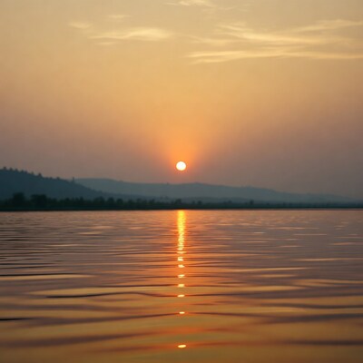 Sunset over lake with mountains
